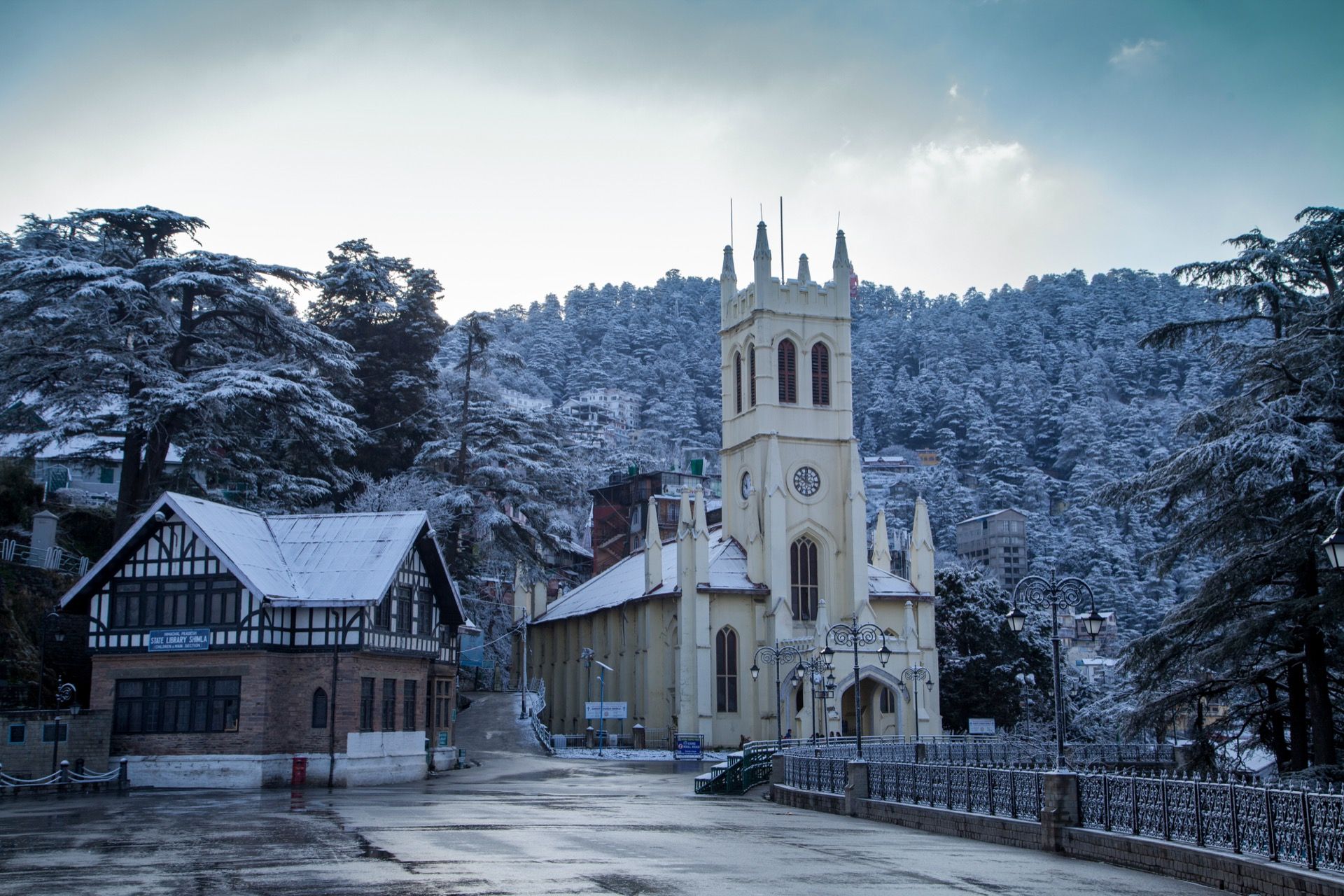 Himachal village and snowy mountain backdrop